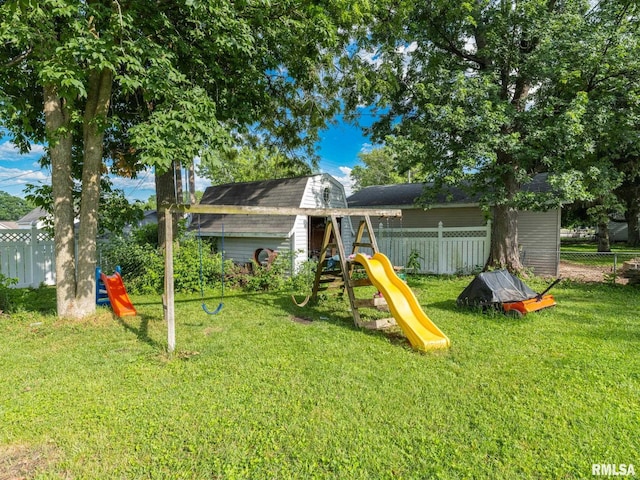 106 N 5th St, Dunlap, IL 61525 - rear view of house featuring a playground and a shed