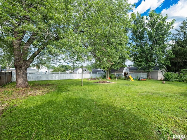 106 N 5th St, Dunlap, IL 61525 - fenced backyard featuring a playground
