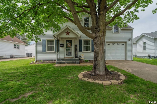 view of front of home featuring concrete driveway, a front lawn, and an attached garage