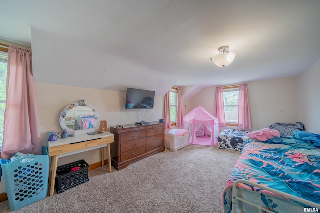 carpeted bedroom featuring lofted ceiling