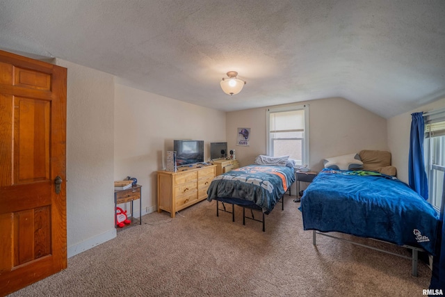 bedroom with light colored carpet, lofted ceiling, a textured ceiling, and baseboards