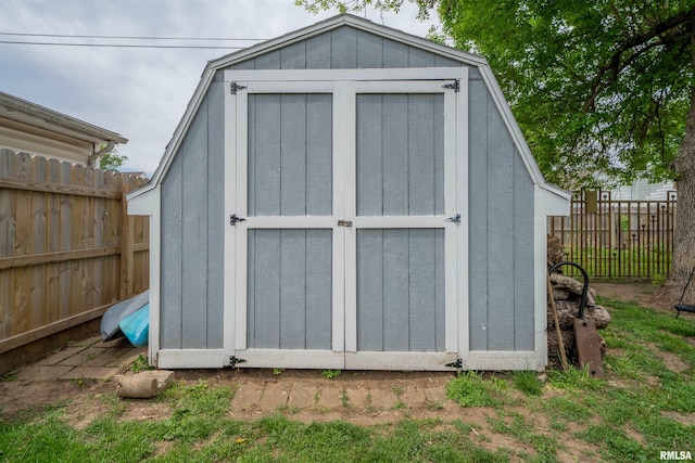 view of shed featuring a fenced backyard