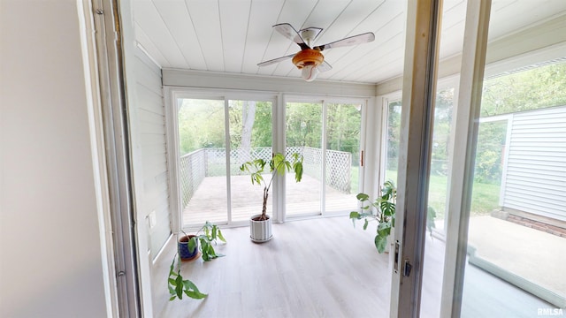 unfurnished sunroom with wooden ceiling and wood finished floors