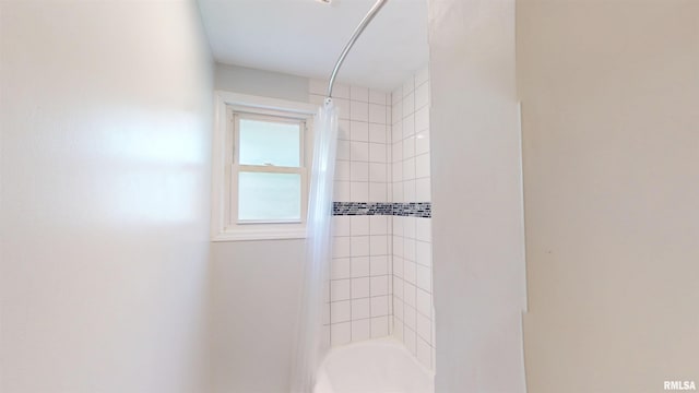 full bath featuring shower / tub combo with curtain
