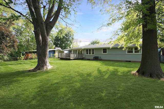 rear view of property with central AC, a yard, a deck, and crawl space
