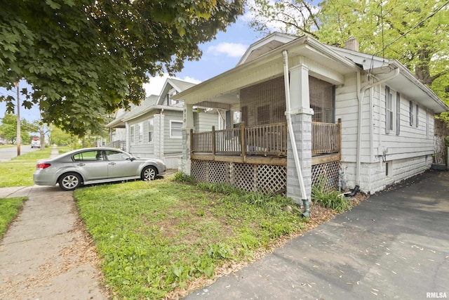 910 W Virginia Ave, Peoria, IL 61604 - view of home's exterior with a chimney and a porch