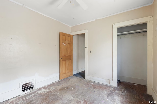910 W Virginia Ave, Peoria, IL 61604 - unfurnished bedroom featuring crown molding, a closet, ceiling fan, and baseboards