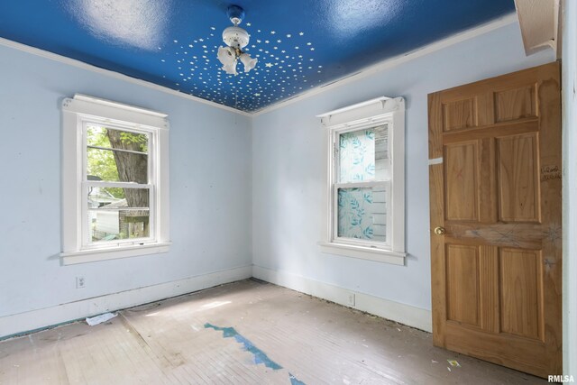 910 W Virginia Ave, Peoria, IL 61604 - unfurnished room featuring healthy amount of natural light and crown molding