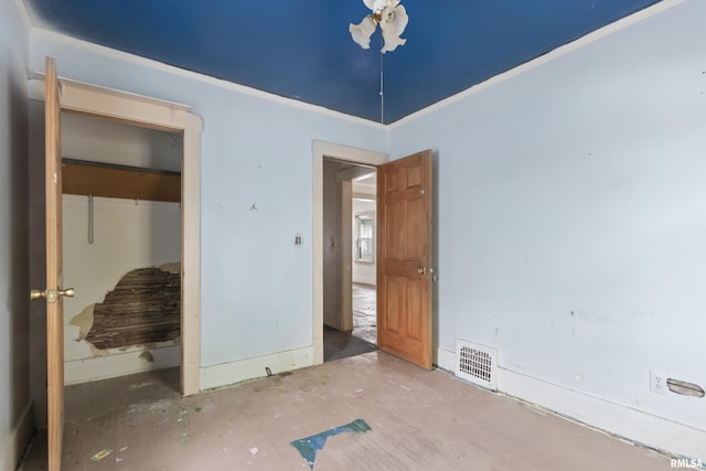 910 W Virginia Ave, Peoria, IL 61604 - unfurnished bedroom with a closet and crown molding