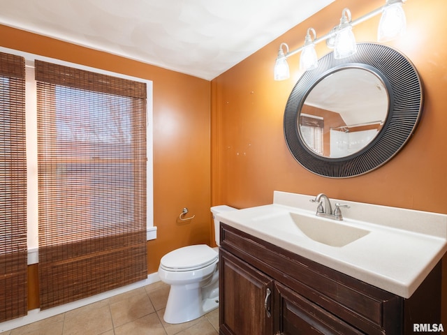 full bath with tile patterned floors, toilet, vanity, and baseboards