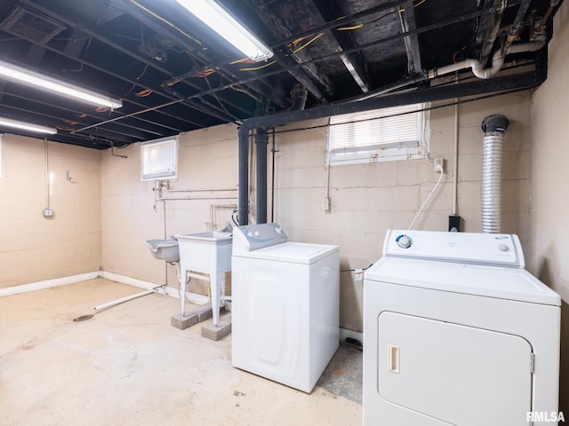 laundry room featuring washing machine and clothes dryer