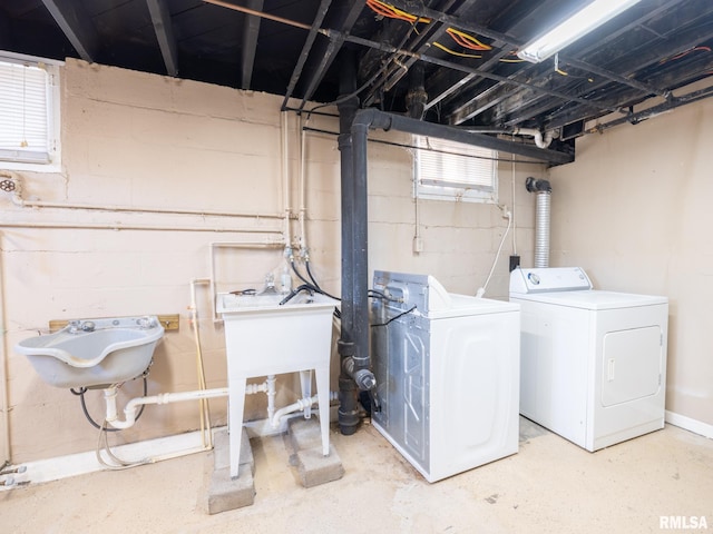 clothes washing area with washing machine and clothes dryer