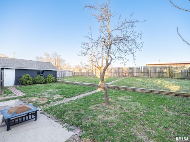 view of yard with an outdoor structure and a patio area
