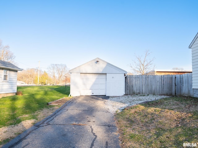 detached garage featuring driveway
