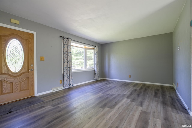 foyer entrance featuring wood finished floors and baseboards