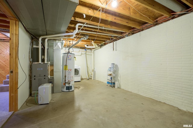 unfinished below grade area featuring gas water heater and brick wall