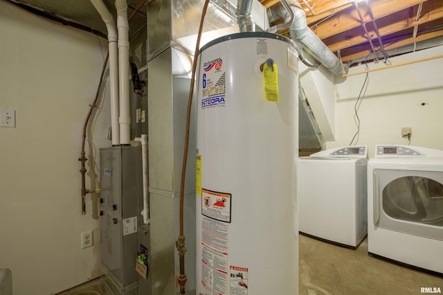 laundry area with gas water heater and independent washer and dryer