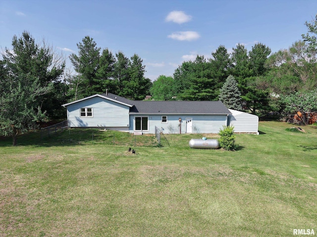rear view of property featuring a chimney