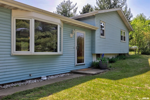 view of property exterior featuring a yard