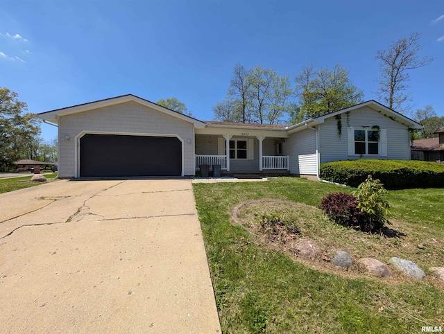 6403 N Talisman Ter, Peoria, IL 61615 - ranch-style house with a porch, an attached garage, concrete driveway, and a front yard