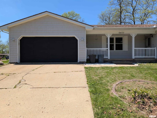 ranch-style house with covered porch, concrete driveway, and a garage