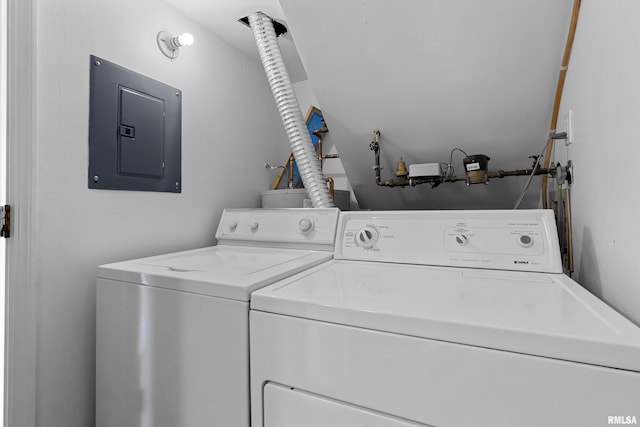 laundry room featuring electric panel and washing machine and clothes dryer