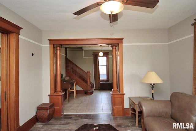 102 2nd St, Camp Grove, IL 61424 - living room featuring stairway, baseboards, a ceiling fan, and wood finished floors