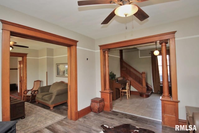 102 2nd St, Camp Grove, IL 61424 - living area featuring stairs, ceiling fan, baseboards, and wood finished floors