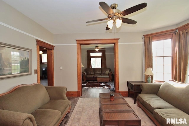 102 2nd St, Camp Grove, IL 61424 - living area featuring ceiling fan, baseboards, and light wood-style flooring