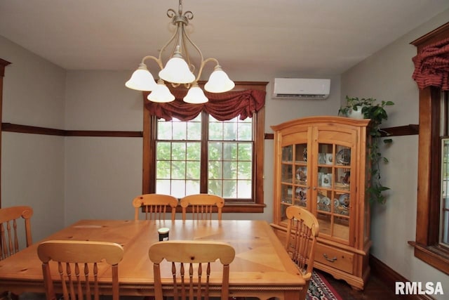 102 2nd St, Camp Grove, IL 61424 - dining area featuring a wall mounted air conditioner and a chandelier