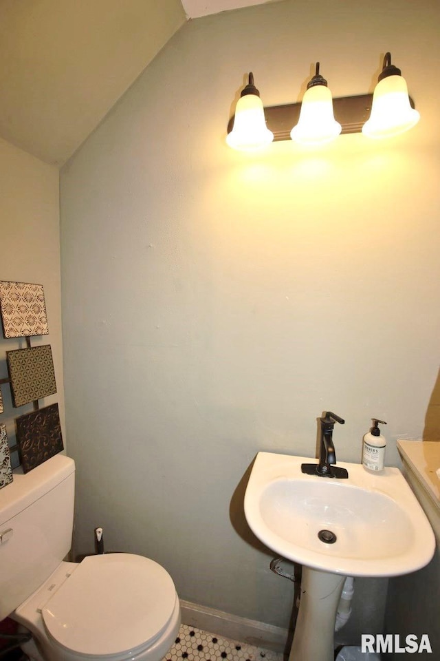 102 2nd St, Camp Grove, IL 61424 - bathroom featuring toilet, a sink, and baseboards