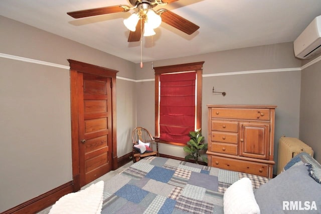 102 2nd St, Camp Grove, IL 61424 - bedroom with radiator, a wall mounted AC, baseboards, carpet flooring, and a ceiling fan