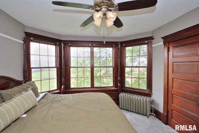 102 2nd St, Camp Grove, IL 61424 - carpeted bedroom featuring radiator heating unit, a ceiling fan, and baseboards