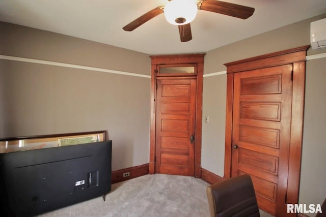 102 2nd St, Camp Grove, IL 61424 - bedroom with light carpet, an AC wall unit, baseboards, and a ceiling fan