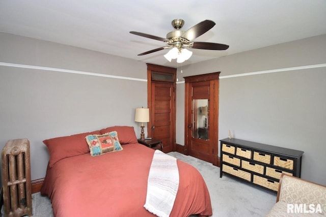 102 2nd St, Camp Grove, IL 61424 - bedroom featuring radiator, light colored carpet, and ceiling fan