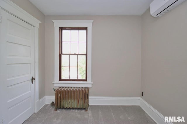 102 2nd St, Camp Grove, IL 61424 - unfurnished room with radiator, an AC wall unit, carpet flooring, and baseboards