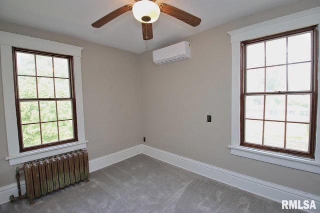 102 2nd St, Camp Grove, IL 61424 - carpeted empty room featuring radiator heating unit, a wall unit AC, baseboards, and ceiling fan