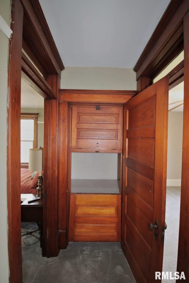102 2nd St, Camp Grove, IL 61424 - hallway featuring dark colored carpet and a desk