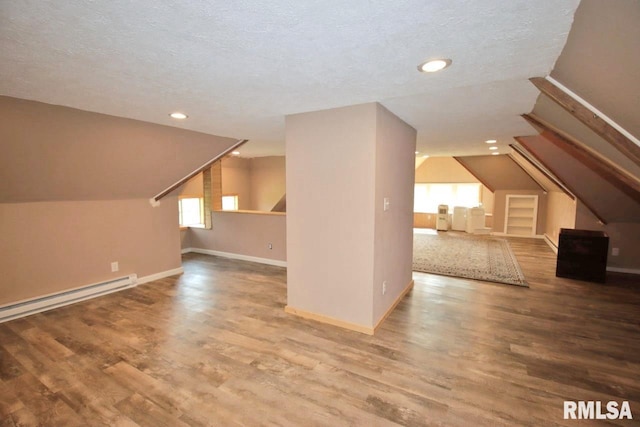 102 2nd St, Camp Grove, IL 61424 - bonus room featuring vaulted ceiling, wood finished floors, recessed lighting, baseboards, and a textured ceiling