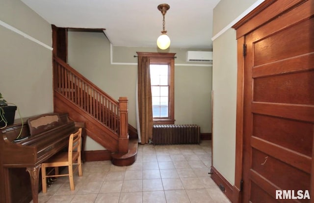 102 2nd St, Camp Grove, IL 61424 - stairs featuring radiator, a wall mounted air conditioner, baseboards, and tile patterned floors