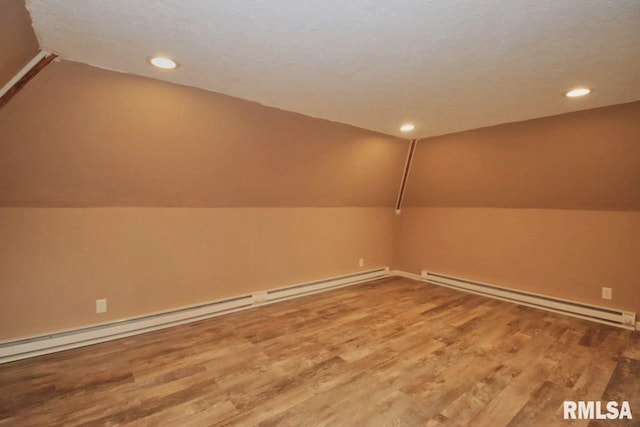 102 2nd St, Camp Grove, IL 61424 - bonus room with a baseboard radiator, lofted ceiling, wood finished floors, recessed lighting, and baseboard heating