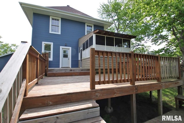 102 2nd St, Camp Grove, IL 61424 - back of house with a sunroom and a deck