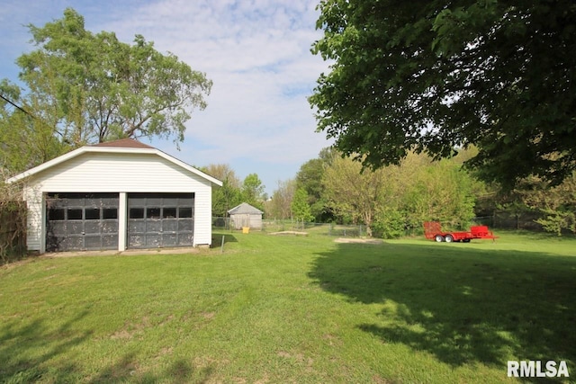 102 2nd St, Camp Grove, IL 61424 - view of yard featuring a garage and an outbuilding