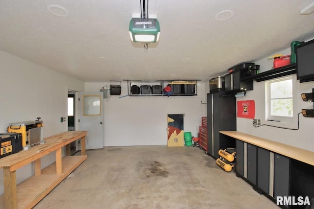 102 2nd St, Camp Grove, IL 61424 - garage featuring a garage door opener