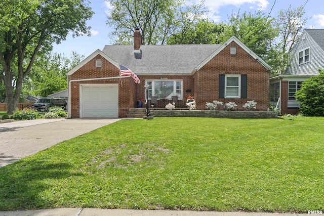 2220 W Ayres Ave, West Peoria, IL 61604 - view of front of house featuring an attached garage, a chimney, brick siding, driveway, and a front yard