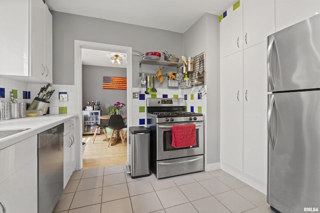 2220 W Ayres Ave, West Peoria, IL 61604 - kitchen with stainless steel appliances, white cabinets, light countertops, and tasteful backsplash