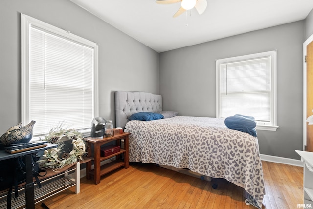 2220 W Ayres Ave, West Peoria, IL 61604 - bedroom featuring light wood-style flooring, a ceiling fan, and baseboards