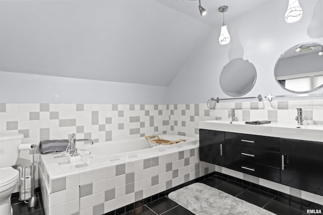 2220 W Ayres Ave, West Peoria, IL 61604 - bathroom with toilet, tile patterned floors, vaulted ceiling, a bath, and double vanity