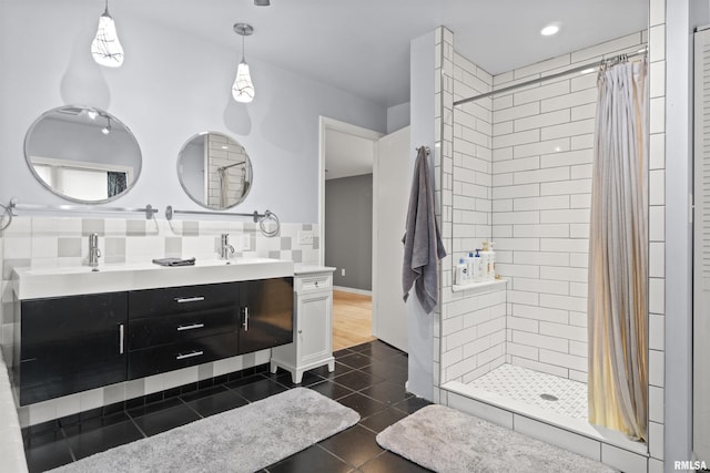 2220 W Ayres Ave, West Peoria, IL 61604 - bathroom with tile patterned flooring, tiled shower, double vanity, and tasteful backsplash