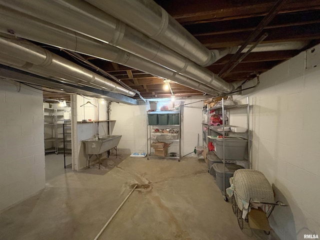 2220 W Ayres Ave, West Peoria, IL 61604 - unfinished below grade area with a sink and concrete block wall